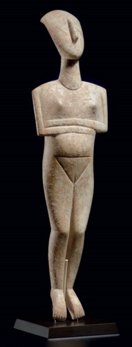 A CYCLADIC MARBLE RECLINING FE
